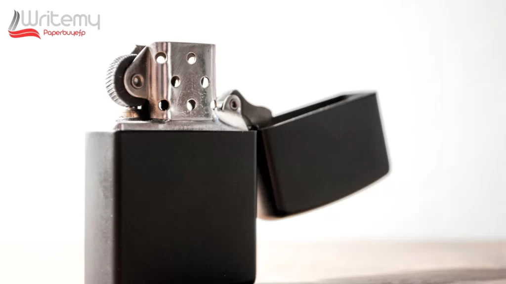 A close-up of a black Zippo lighter with its lid open, focusing on the metal flint wheel. Can You Use Zippo Lighter Fuel as a Lubricant is a key question addressed in this image